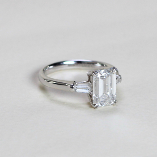 2.21cts Emerald cut Lab-grown trilogy ring