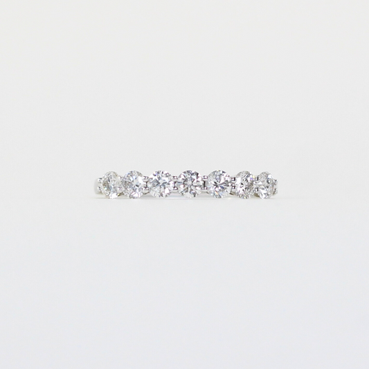 7-stone diamond ring in shared/wave prong setting