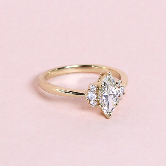 Marquise Diamond Ring with Round Accent Stones