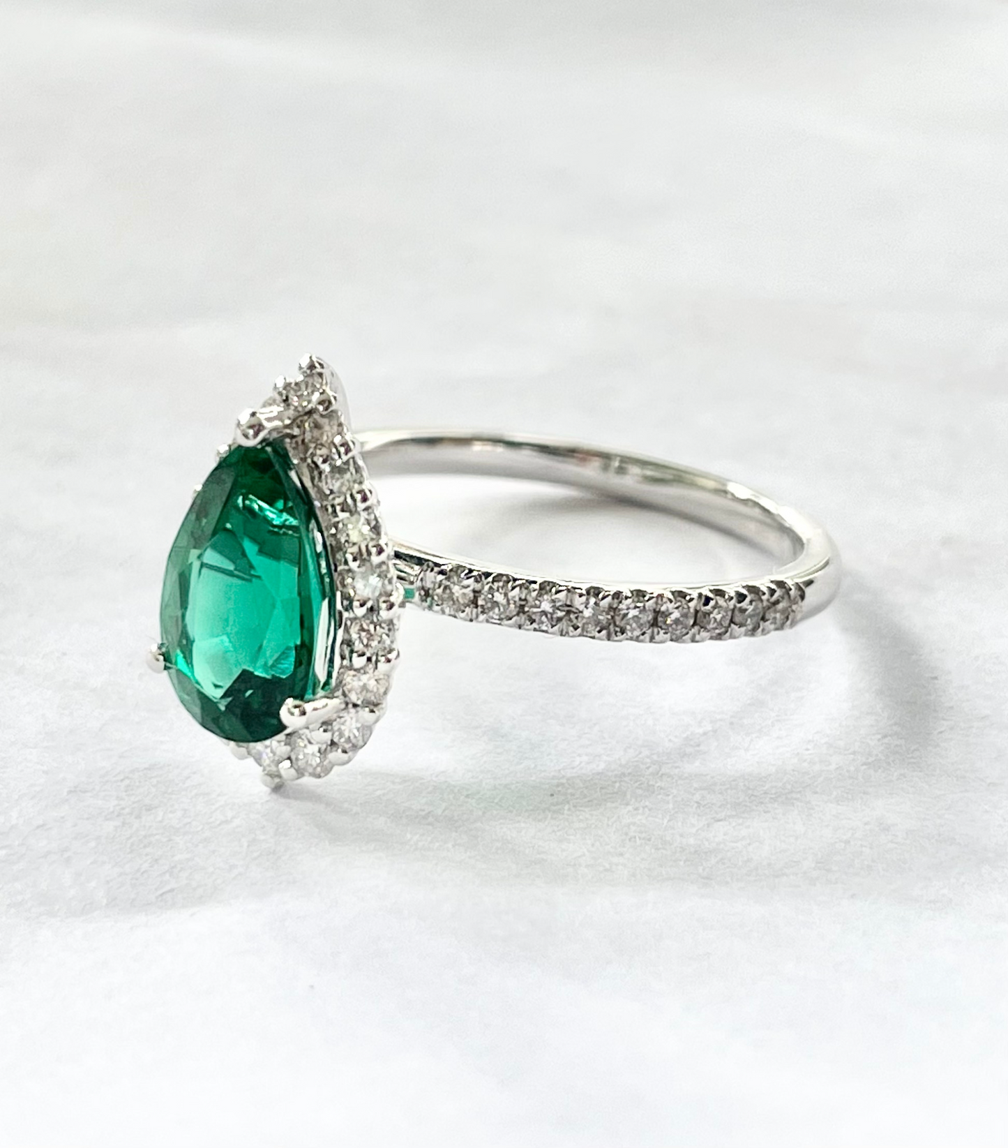 1.80cts Pear cut Emerald Pavé ring with Halo