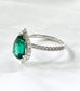 1.5ct Pear-shaped Emerald gemstone ring with halo in Pave setting