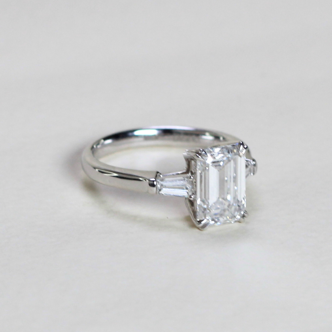2.21cts Emerald cut Lab-grown trilogy ring