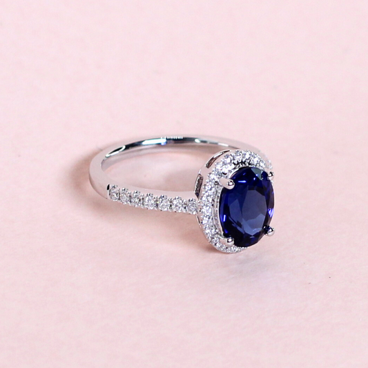 1.5ct Oval Blue sapphire with Halo on half eternity band