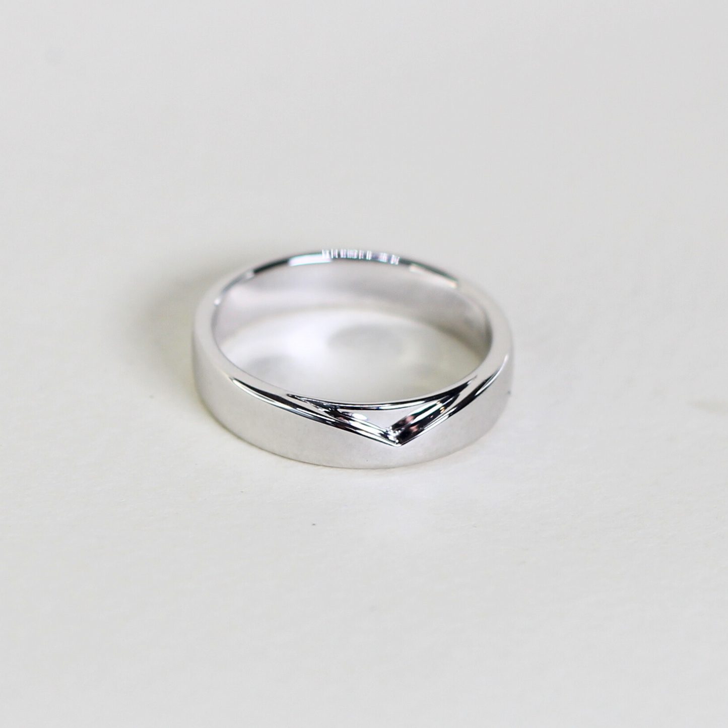 Plain Male wedding band with V-shaped accent