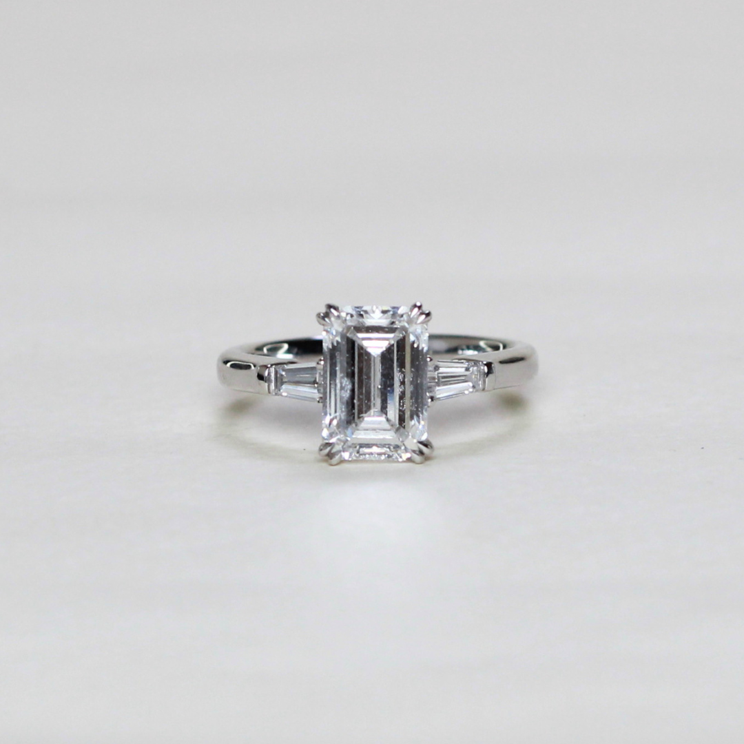 2.21cts Emerald cut Lab-grown trilogy ring