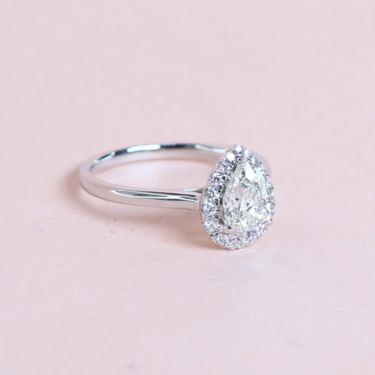 .90ct Pear diamond ring with graduating halo