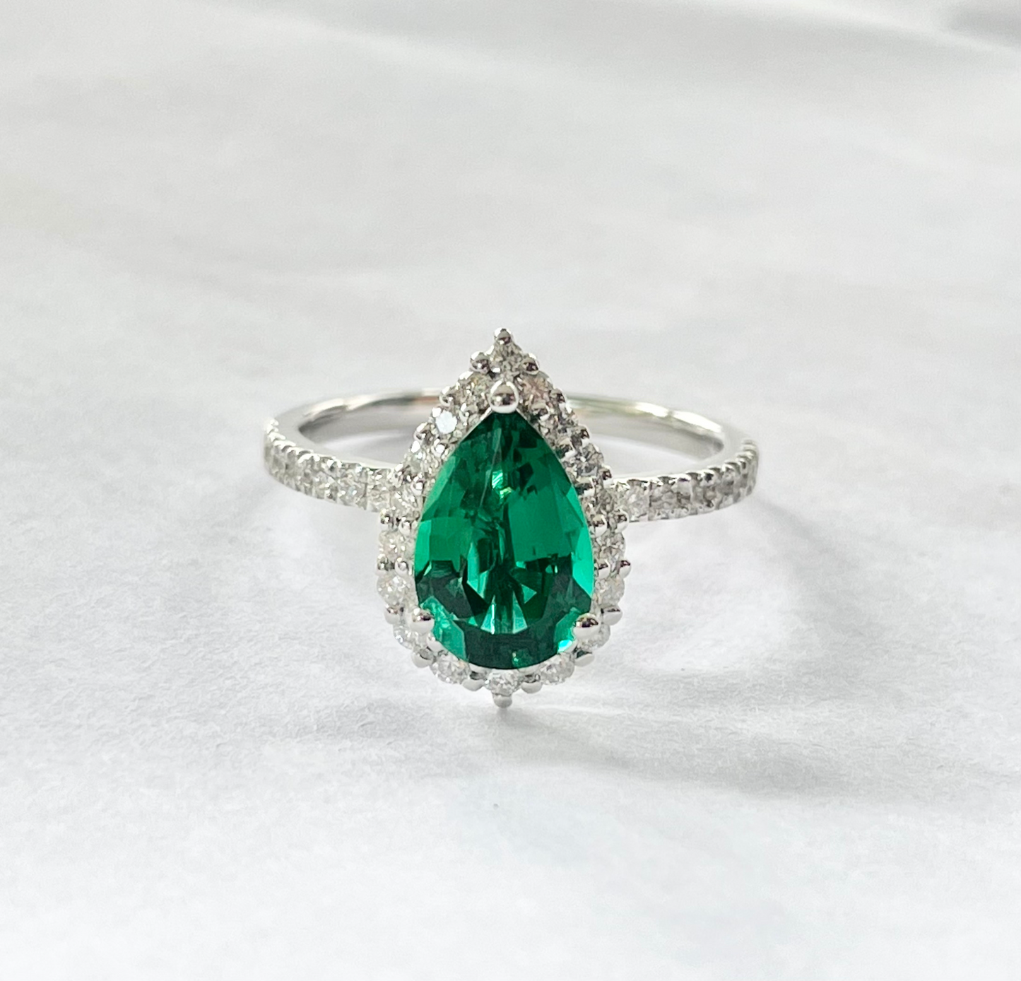1.5ct Pear-shaped Emerald gemstone ring with halo in Pave setting